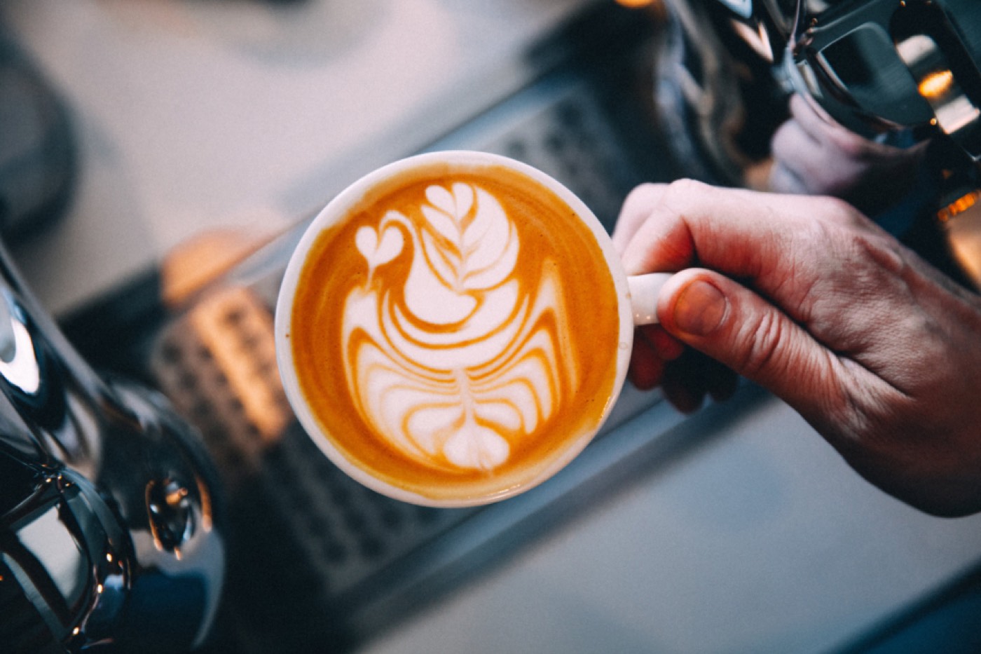 Barista pouring latte art